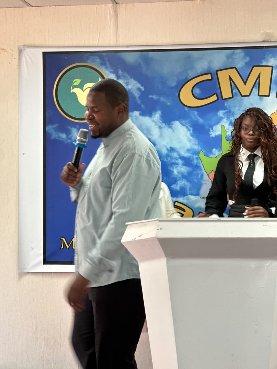 A pastor ministering behind the pulpit