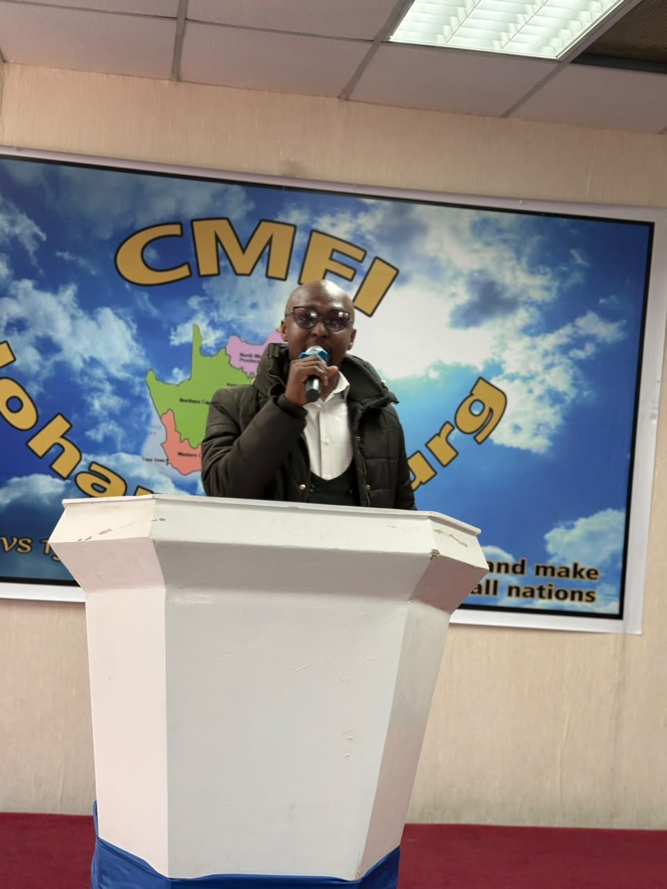 A pastor preaching at CMFI Johannesburg