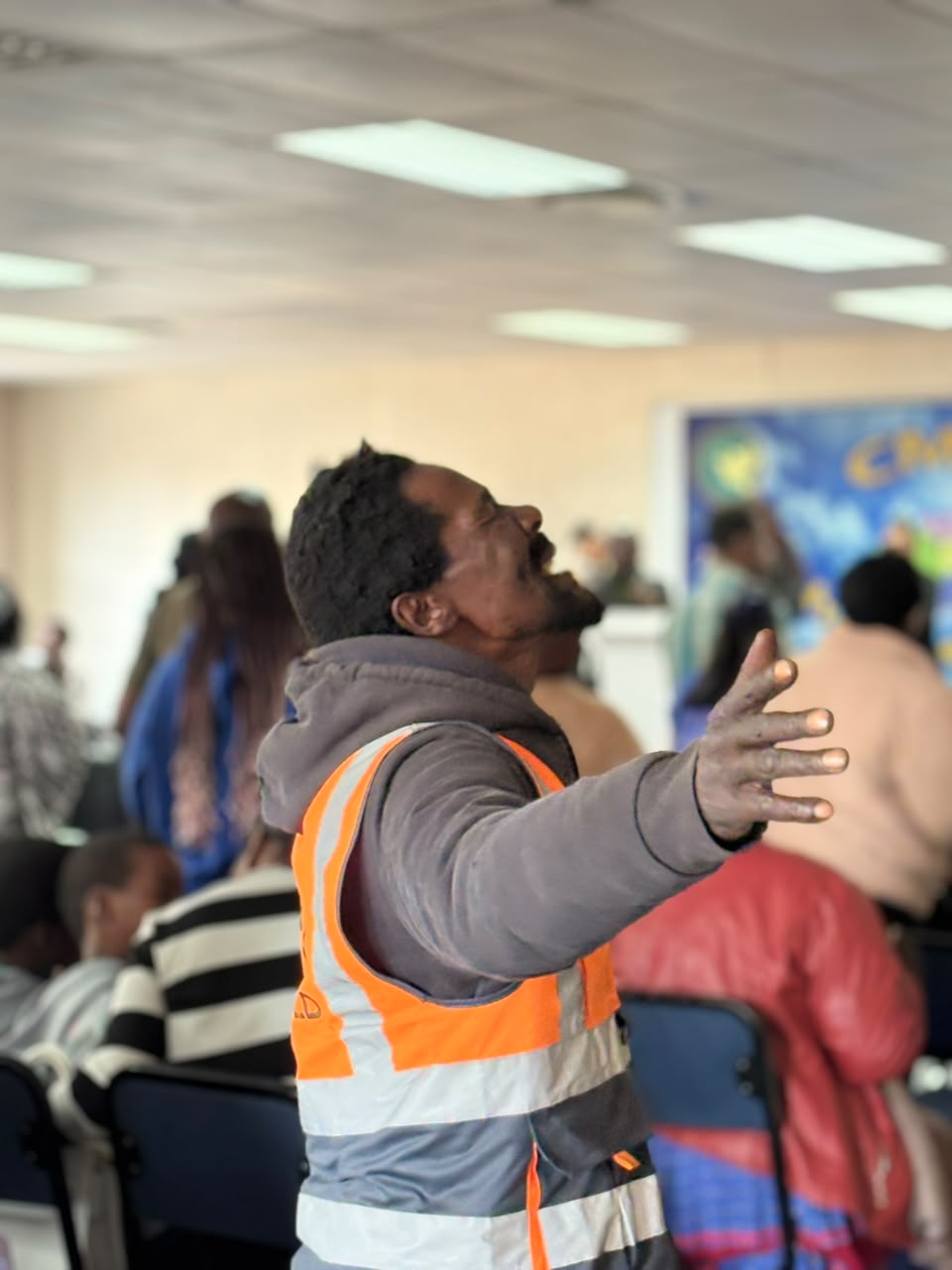A worshipper lifting his hands in praise